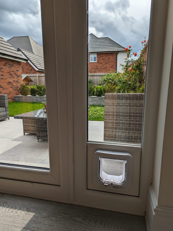 SureFlap Microchip Cat Flap into uPVC below Glass SureFlap Microchip Cat Flap into uPVC below Glass