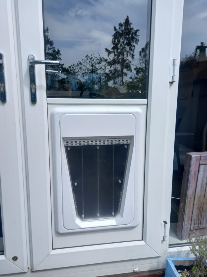 Pet Safe Microchip Dog Door into uPVC below Glass Large Pet Safe Microchip Dog Door into uPVC below Glass