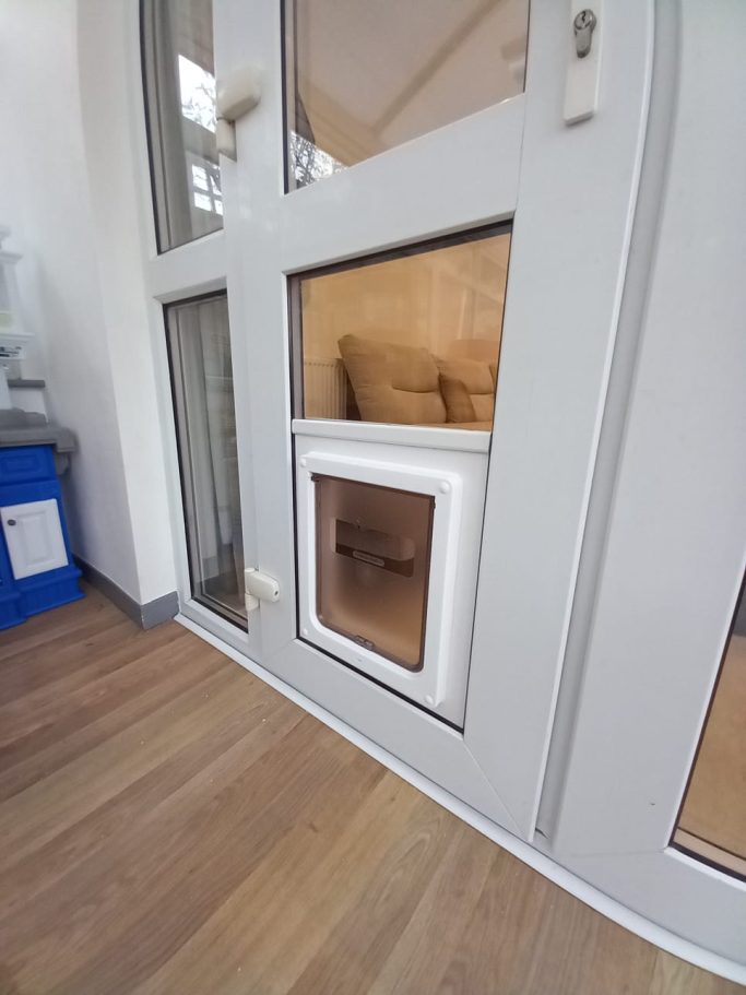 Closer Pets Manual Cat Flap into uPVC below Glass Closer Pets Manual Cat Flap into uPVC below Glass