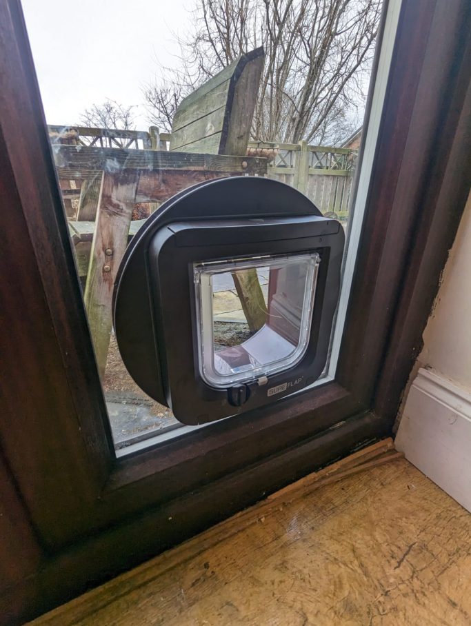 Brown SureFlap Microchip Cat Flap into Glass Brown Sure Flap Microchip Cat Flap through Glass