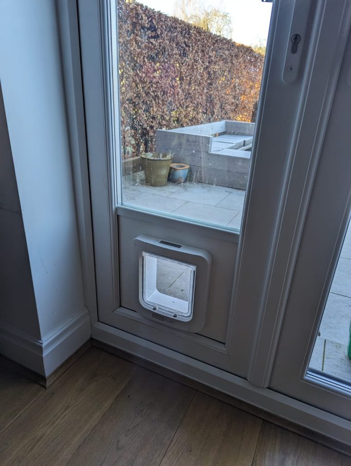 SureFlap Microchip Pet Door into uPVC below Glass SureFlap Microchip Pet Door into uPVC below Glass